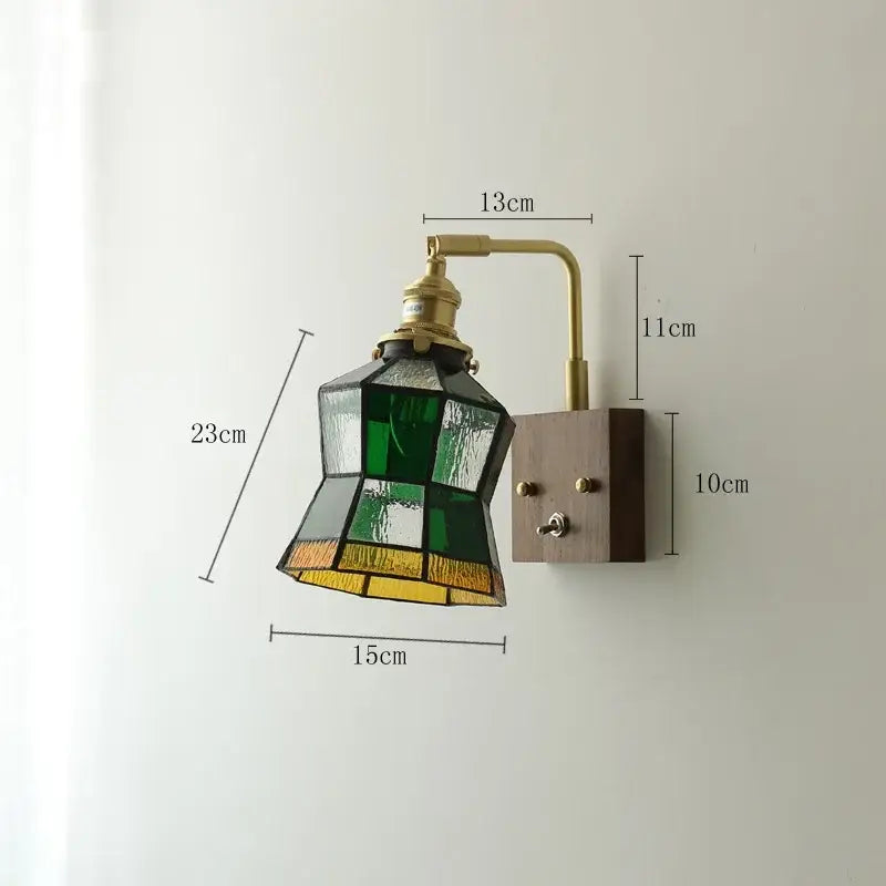 Vintage-style brass led wall light with wooden base and green yellow stained glass shade for living room use