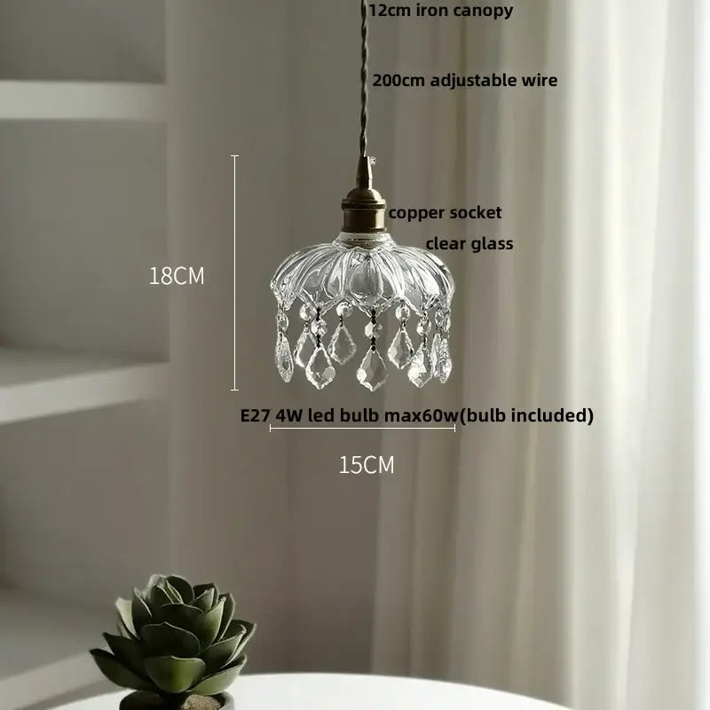 A delicate decorbites clear glass led pendant light with copper socket and crystal droplets for dining room decor