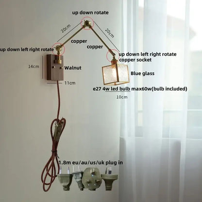 Adjustable copper wall sconce with blue glass shade and walnut-finished ash wood led decorbites mounting plate