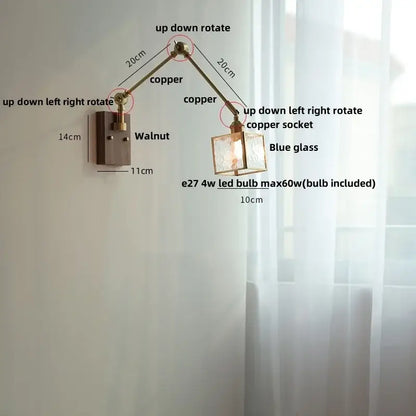 Adjustable brass decorbites ash wood wall sconce with blue glass shade and walnut-finished mounting plate for bedroom lighting