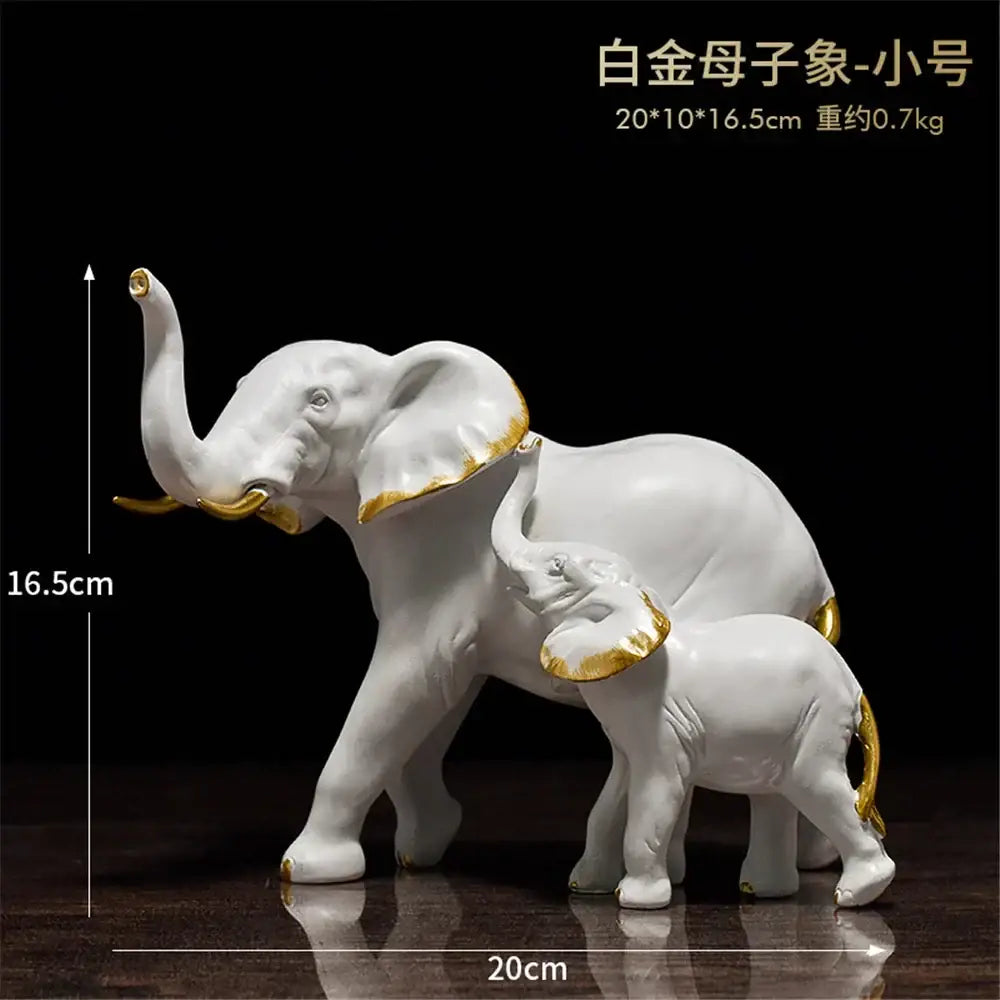 White ceramic mother and baby elephant figurine with gold accents for brass elephant art decor living room display by decorbites elephant art