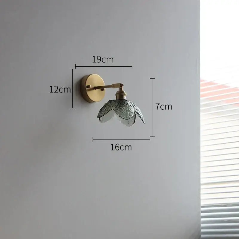 Delicate brass wall lamp with textured translucent gray glass led flower shade for bathroom use