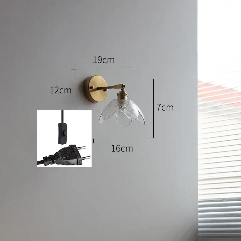 Brass flower gray glass led bathroom wall lamp featuring a delicate brass wall sconce with textured glass shade
