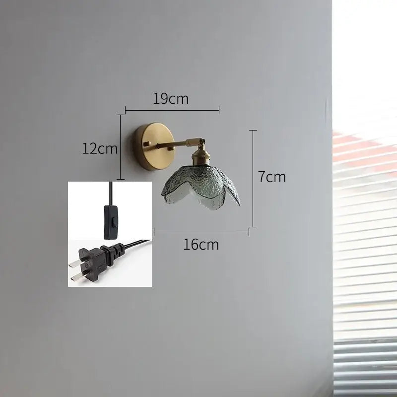 Vintage wall lamp with brass base and gray textured glass led shade designed for bathroom lighting