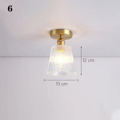 Gold-toned ceiling lamp with clear vertically ribbed glass shade pendant for kitchen lighting use