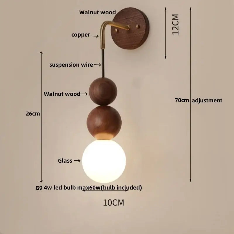A modern wall lamp with led walnut wood spheres, walnut circular base, and frosted glass globe for bedroom decorbites