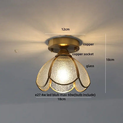 A warm-toned brass red butterfly glass led ceiling light with copper socket and textured petals for bedroom decor