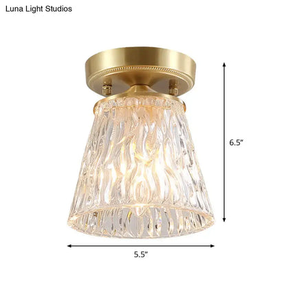 Decorbites brass 1-light semi flush mount with clear ripple fluted glass cone flower design and gold-toned base