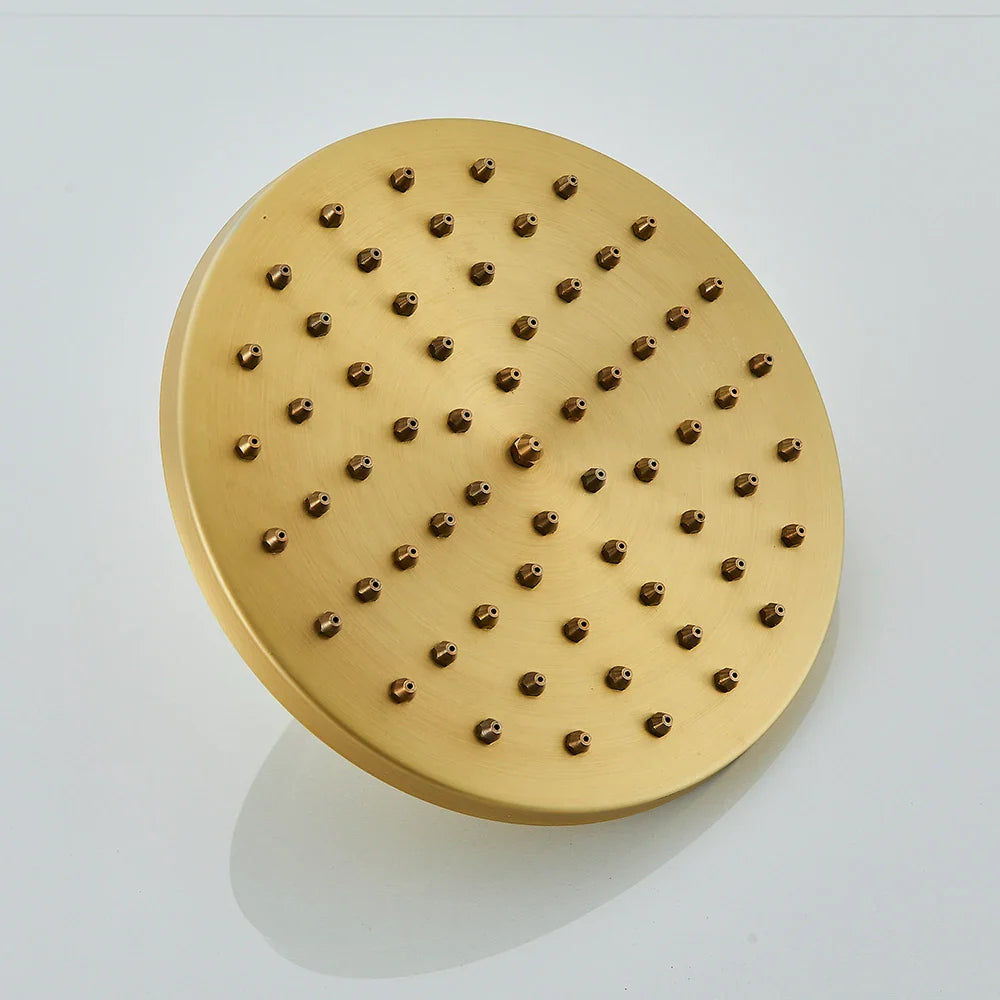 Gold-colored round brass showerhead with matte finish and evenly spaced nozzles in antique brass shower faucet set wall mount