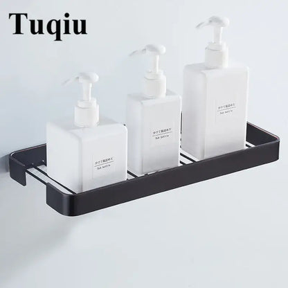 Black metal wall-mounted soap dispenser rack holding three white pumps with decorbites brass square bathroom shower shelf