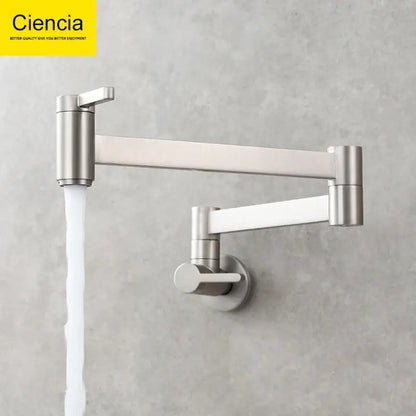 Stainless steel articulated kitchen faucet with dual handles for hot and cold water in brass wall mounted pot filler design