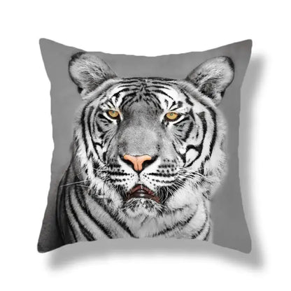 Gray throw pillow with a brave tiger pattern print featuring a white tiger with yellow eyes for living room decor