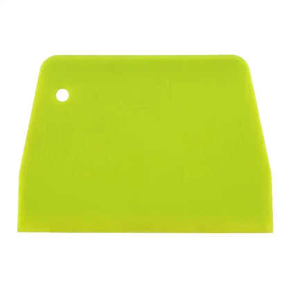 Bright green silicone spatula dough cutter with rounded handle and hole for decorbites cake spatula use