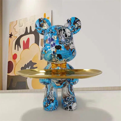 Blue vinyl bear figurine with british flag floral graffiti design gold bow tie holding golden tray for key storage decorbites graffiti bear