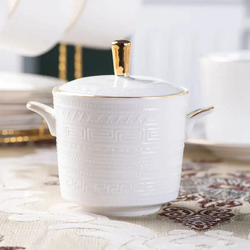 White ceramic sugar bowl from british white tea set with gold trim and embossed greek key pattern decorbites bone