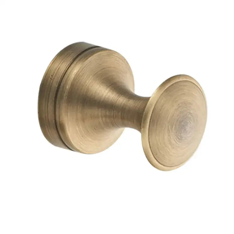 Antique brass-finished round knob with brushed metallic surface and concentric grooves in decorbites bronze bathroom accessories set