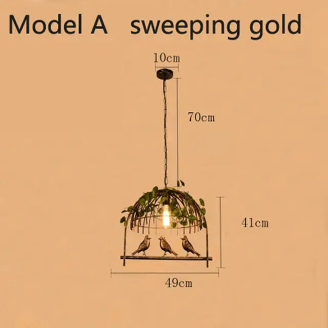 Bronze birdcage pendant lights with a sweeping gold design, three birds, and greenery garland for dining room decor