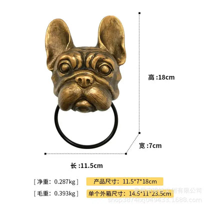 Bronze dog head door knocker pendant with a french bulldog design and black circular ring for courtyard wall use