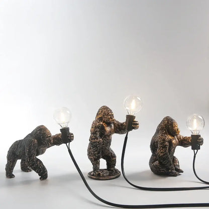 Bronze king kong gorilla table lamp with textured fur finish holding exposed light bulbs for bedroom night light
