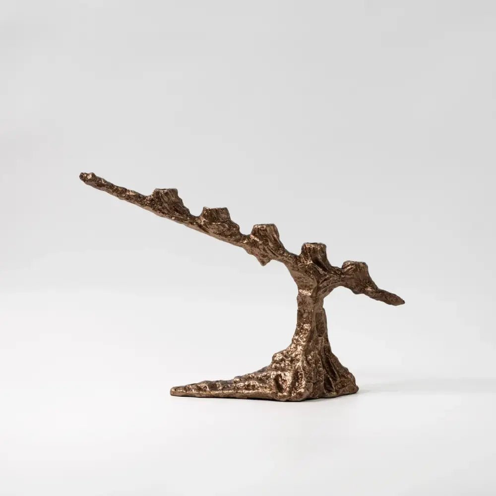 Bronze-colored textured resin candle holder shaped like a stylized tree with gnarled branches and root base for decorbites bamboo candle holder dining room centerpiece