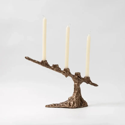 Bronze tree branch bamboo candle holder with three cream candles as a dining room centerpiece decorbites bamboo candle holder