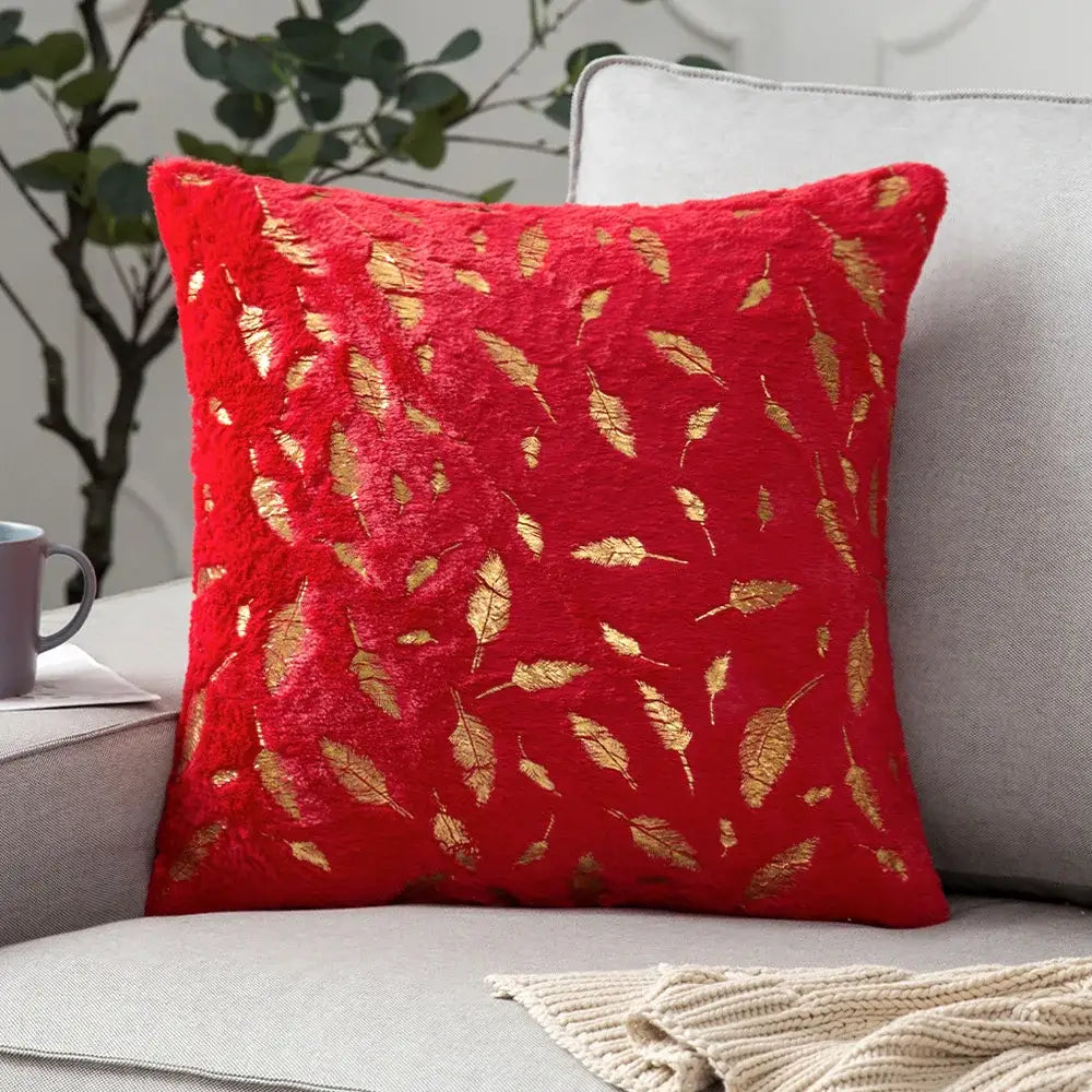 Red plush throw pillow with gold leaf embroidery featuring bronzed feather style for elegant living room decor