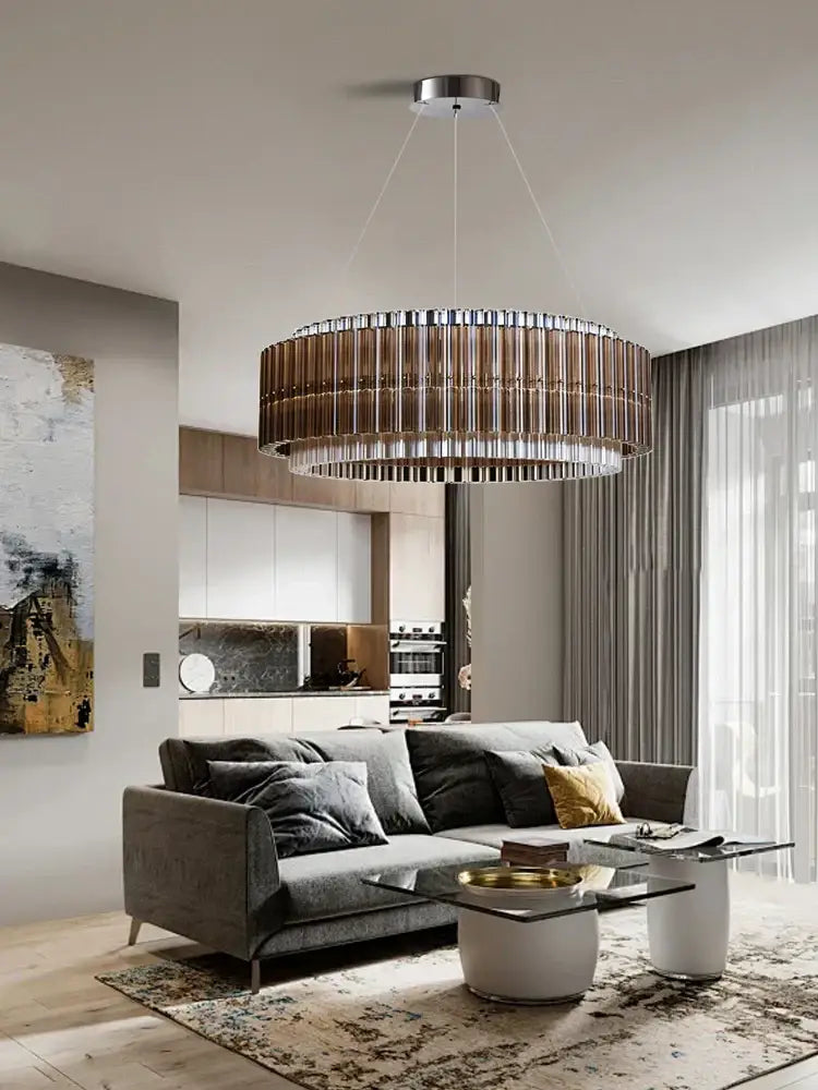 A modern decorbites brown crystal luxury chandelier with a metallic frame and vertical glass rods for living room use