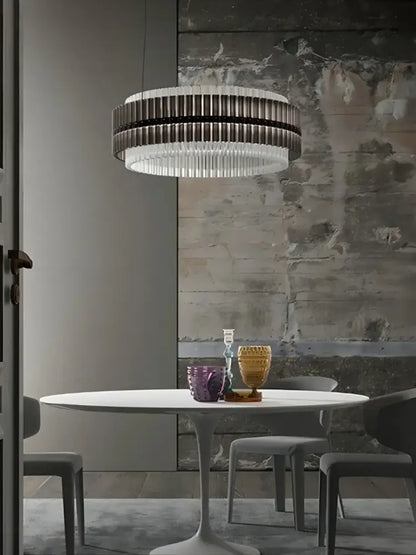 A modern circular brown crystal luxury chandelier with sleek layered dark and clear glass rods for living room decorbites brown crystal
