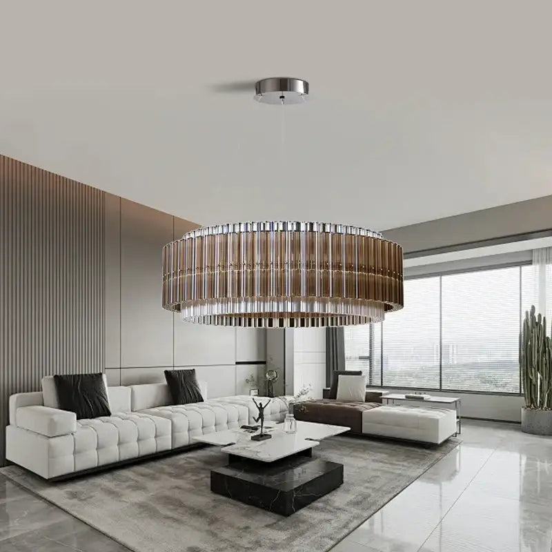 A modern decorbites brown crystal luxury chandelier with metallic frame and amber-tinted glass rods for living room decor