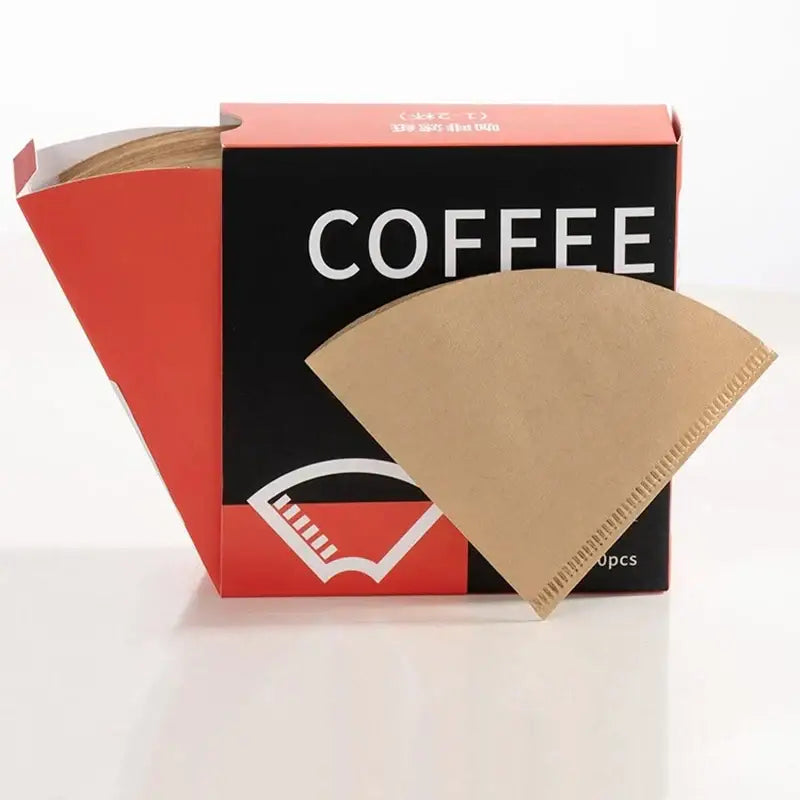 Brown filter paper coffee cone with serrated edge displayed in front of red and black decorbites coffee cone packaging