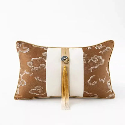 Brown and cream embroidered clouds jacquard throw pillow cover with central white stripe and gold-tasselled button detail