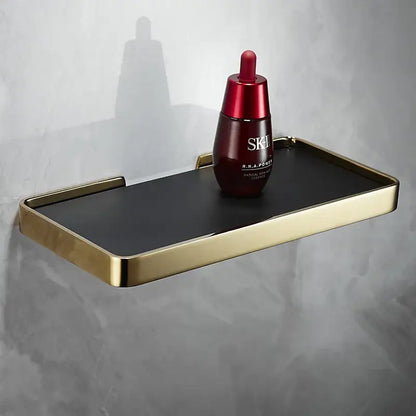 Brushed gold and black corner shelf holding red SK-II facial essence bottle for brushed gold bathroom storage decorbites