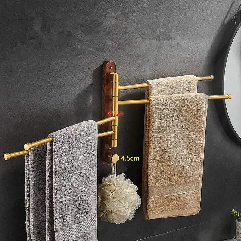 Brushed gold multi-armed swivel towel hanger with dark wood base for bathroom use enhancing style and function