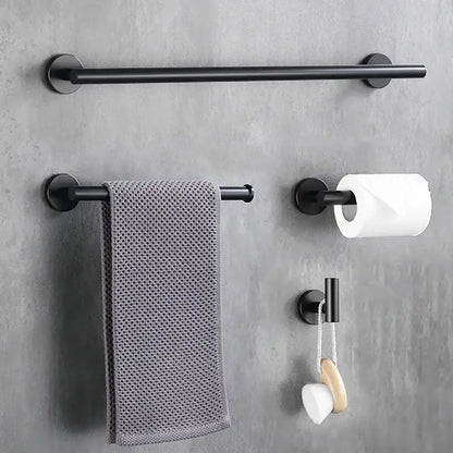Black matte metal towel rack with circular mounts and textured gray towel for decorbites brushed gold bathroom set