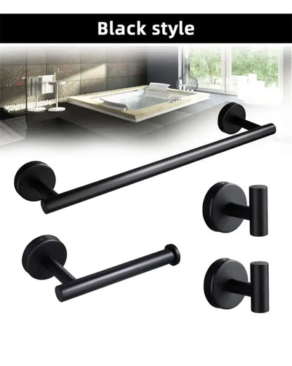 Black matte metal towel rack and toilet paper holder contrast a brushed gold bathroom hardware set for modern use