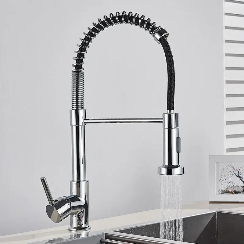 Brushed gold kitchen faucet with flexible spring hose and chrome finish featuring extendable spray head and coiled design