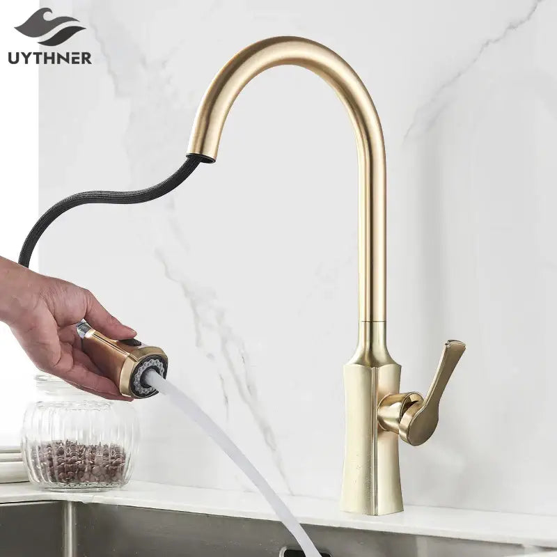 Brushed gold kitchen faucet with sleek curved spout and pull out spray head by decorbites brushed gold