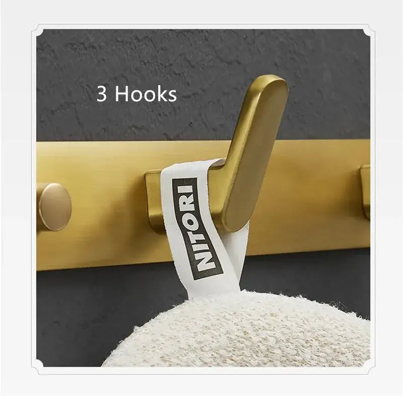 Brushed gold metal robe hook with sleek modern design and nitori tag for bathroom and kitchen wall hardware decorbites brushed gold