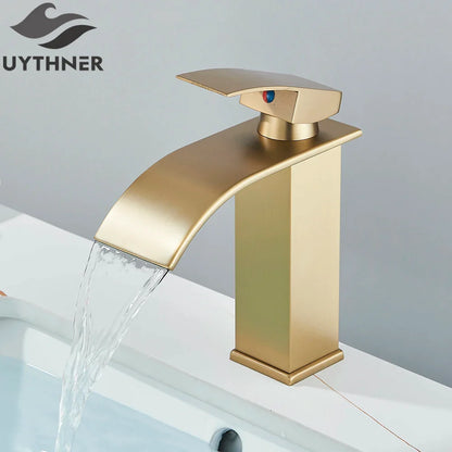 Brushed golden basin faucet with a single hole deck mount and sleek waterfall spout in modern brass mixer taps design