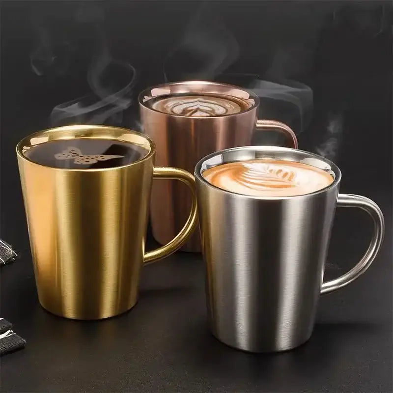 Three stainless steel thermal mugs in gold rose gold and silver with brushed metallic finish and sturdy handles