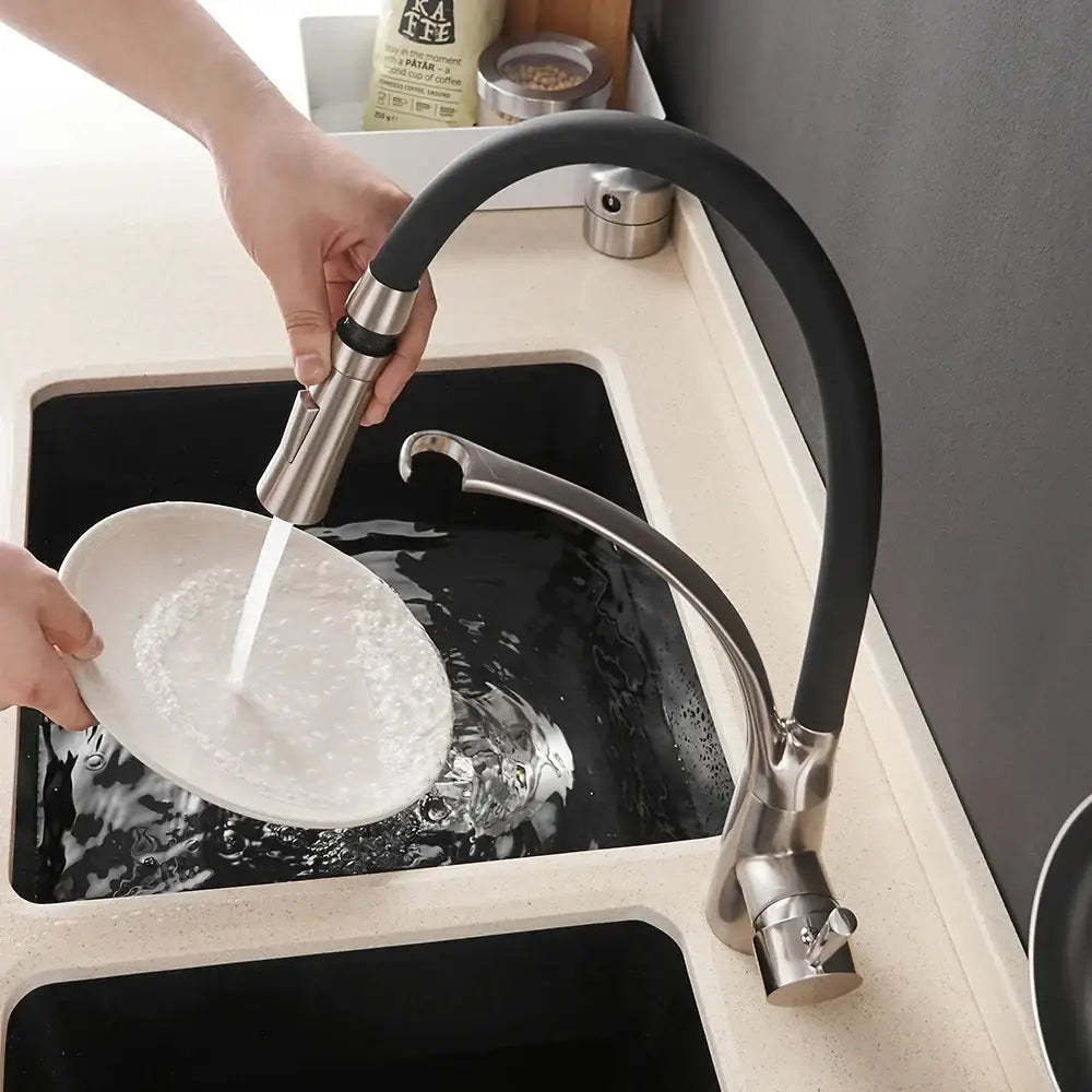 Brushed nickel and black kitchen sink faucet with flexible hose and pull down spray for versatile use