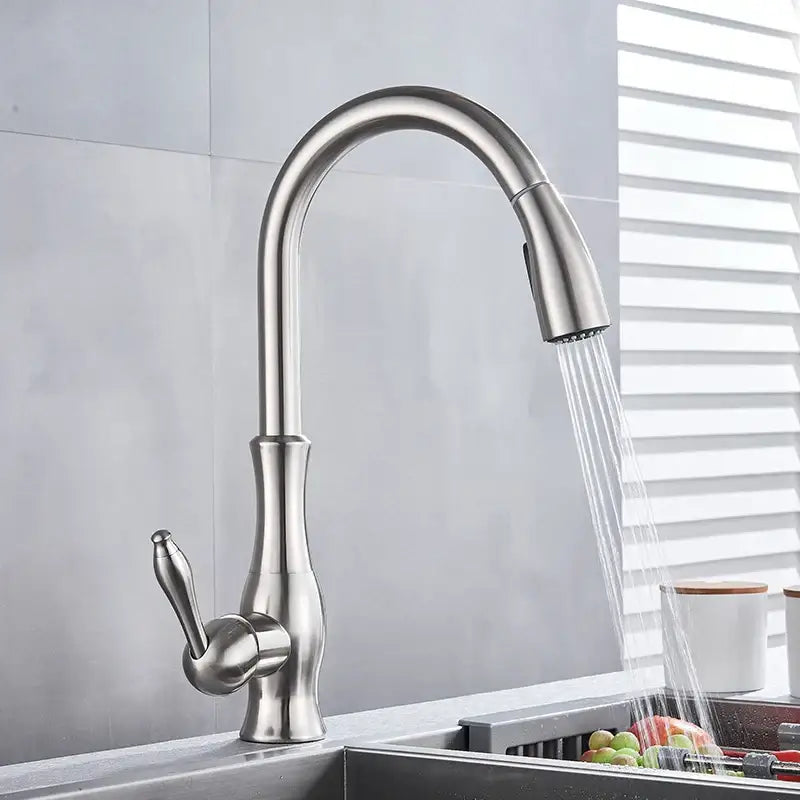 Brushed nickel kitchen faucet with a sleek curved spout and pull-down sprayer from DecorBites brushed nickel collection