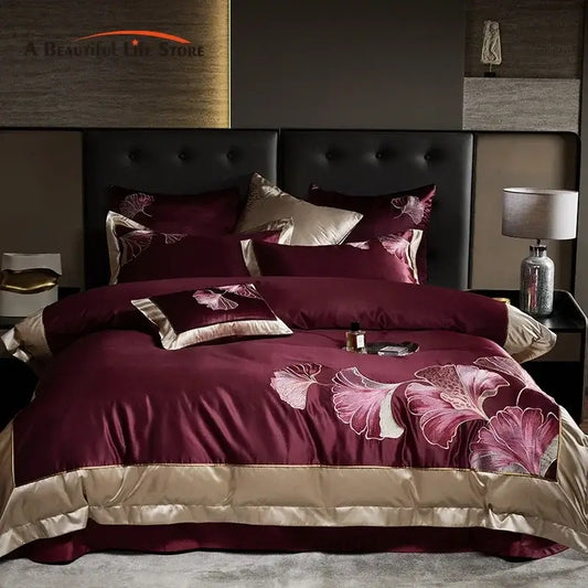 Burgundy and gold satin bedding set with embroidered ginkgo biloba pattern made of egyptian cotton by decorbites