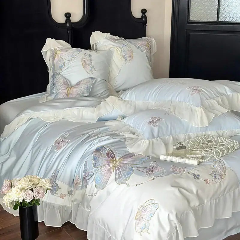 Light blue cotton bedding set with delicate decorbites butterfly embroidery and soft lace ruffles for elegant bedroom decor