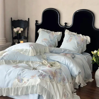Light blue cotton bedding set with decorbites butterfly embroidery and delicate lace ruffles for elegant bedroom decor