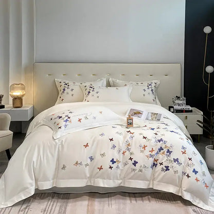 White cotton bedding set with delicate decorbites butterfly embroidery in pastel blue purple and orange for bedroom decor