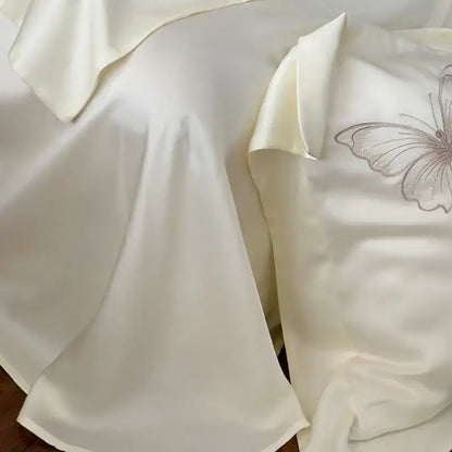 Cream-colored satin pillowcase with butterfly flowers embroidery from decorbites butterfly flowers bedding set