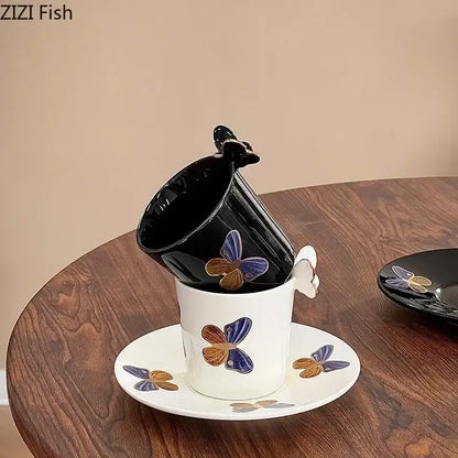 White ceramic butterfly pattern ceramic cup with blue and gold decals paired with matching saucer for dining room decorbites