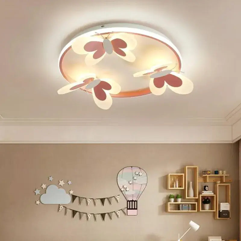 Round ceiling light with three white and maroon butterfly pink decorbites butterfly pink cutouts with warm glow