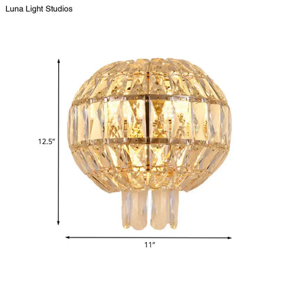 Butterfly tiered gold finish crystal wall sconce with a spherical gold-toned faceted chandelier and three hanging arms